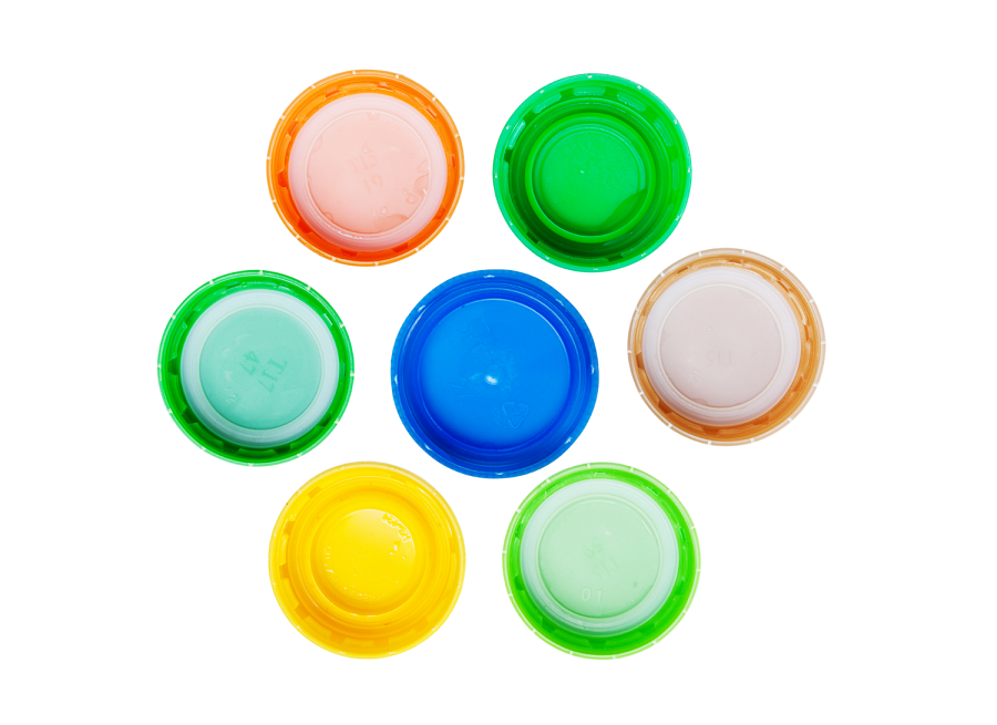 Seven bottle caps in different designs and colours