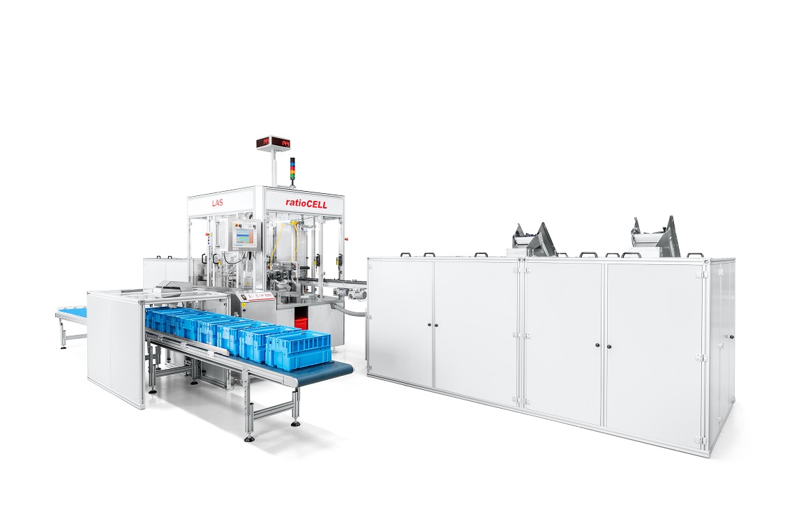General view of an assembly machine for strike plates with feeders and output into small load carriers