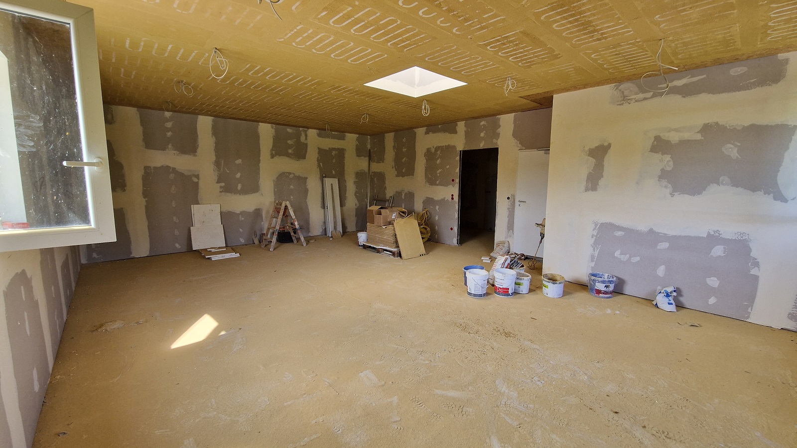 Office space as built with plastered drywalls and air-conditioned clay ceiling